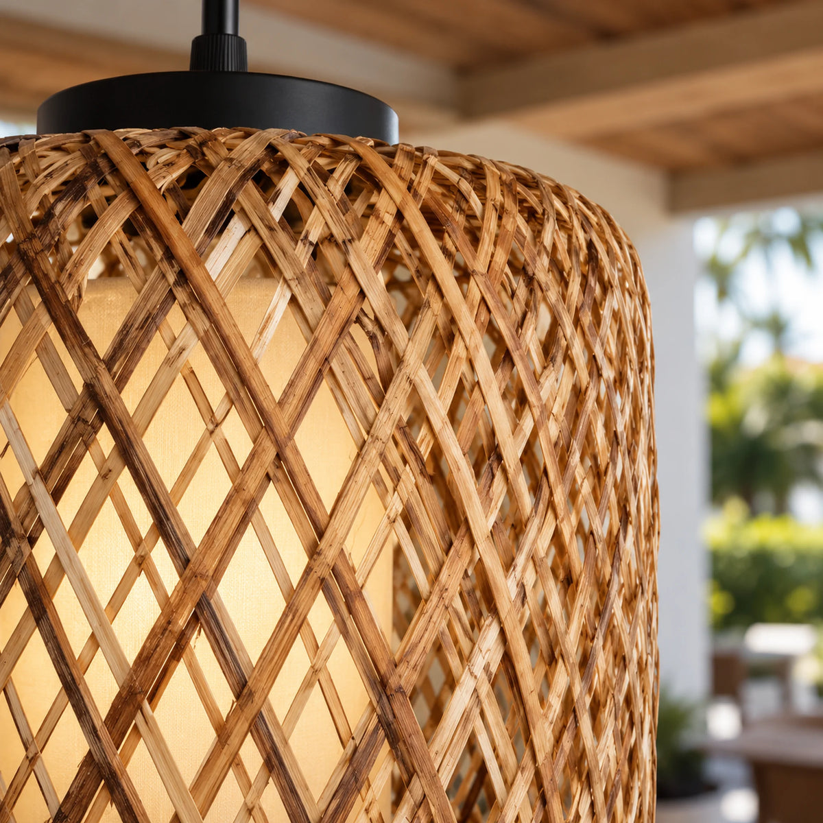Close-up of Tressora’s crossing rattan strips around the pale central lamp enclosure.