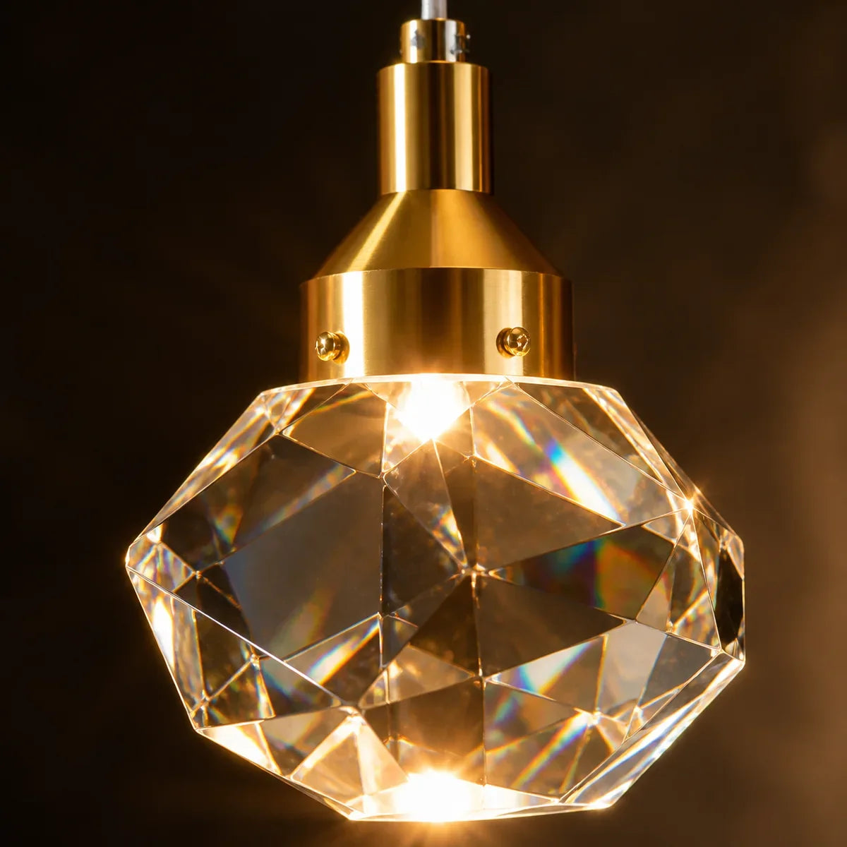 Luminara faceted crystal and polished gold cap detail