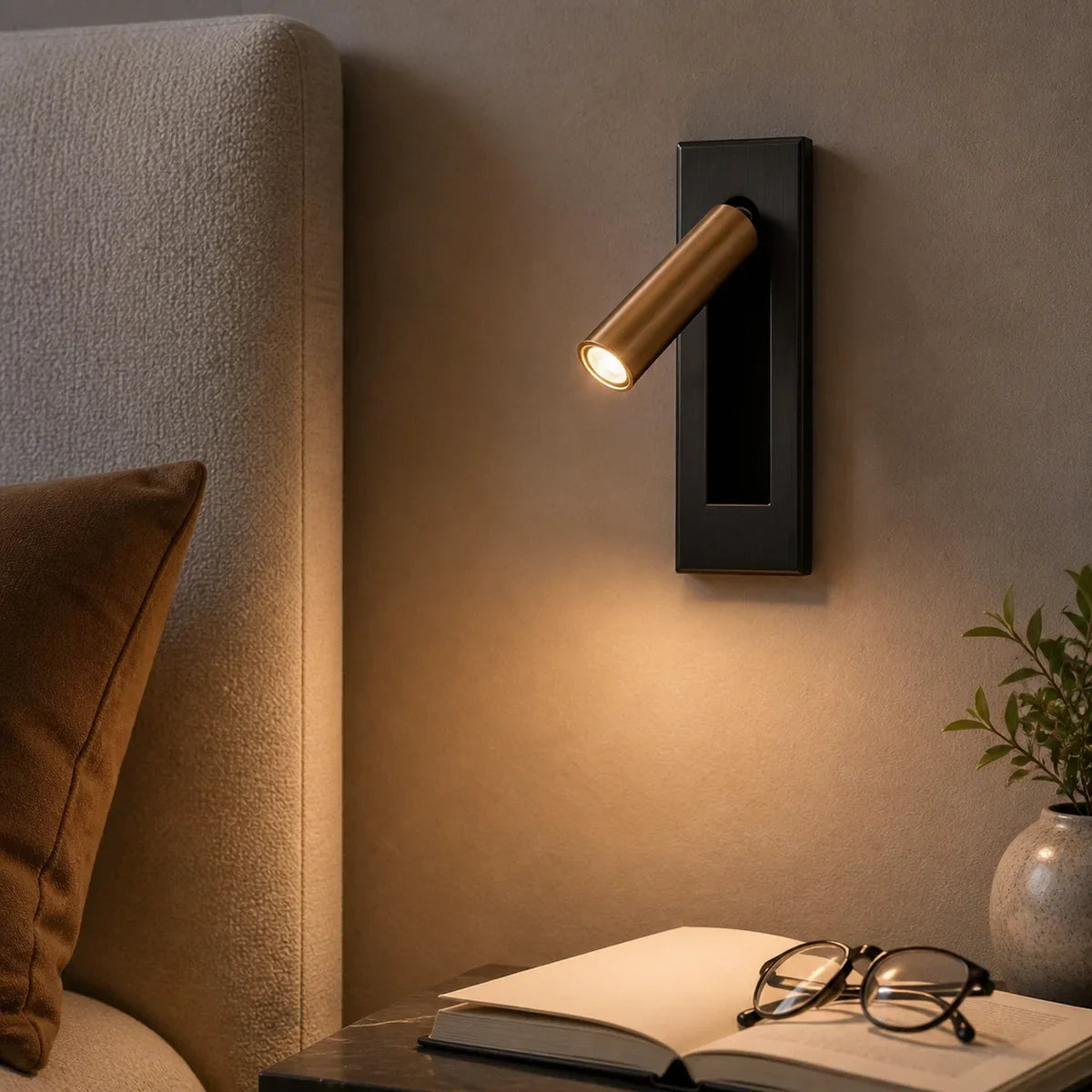 Luminara Matt Black and Copper hidden-switch reading light beside a bed